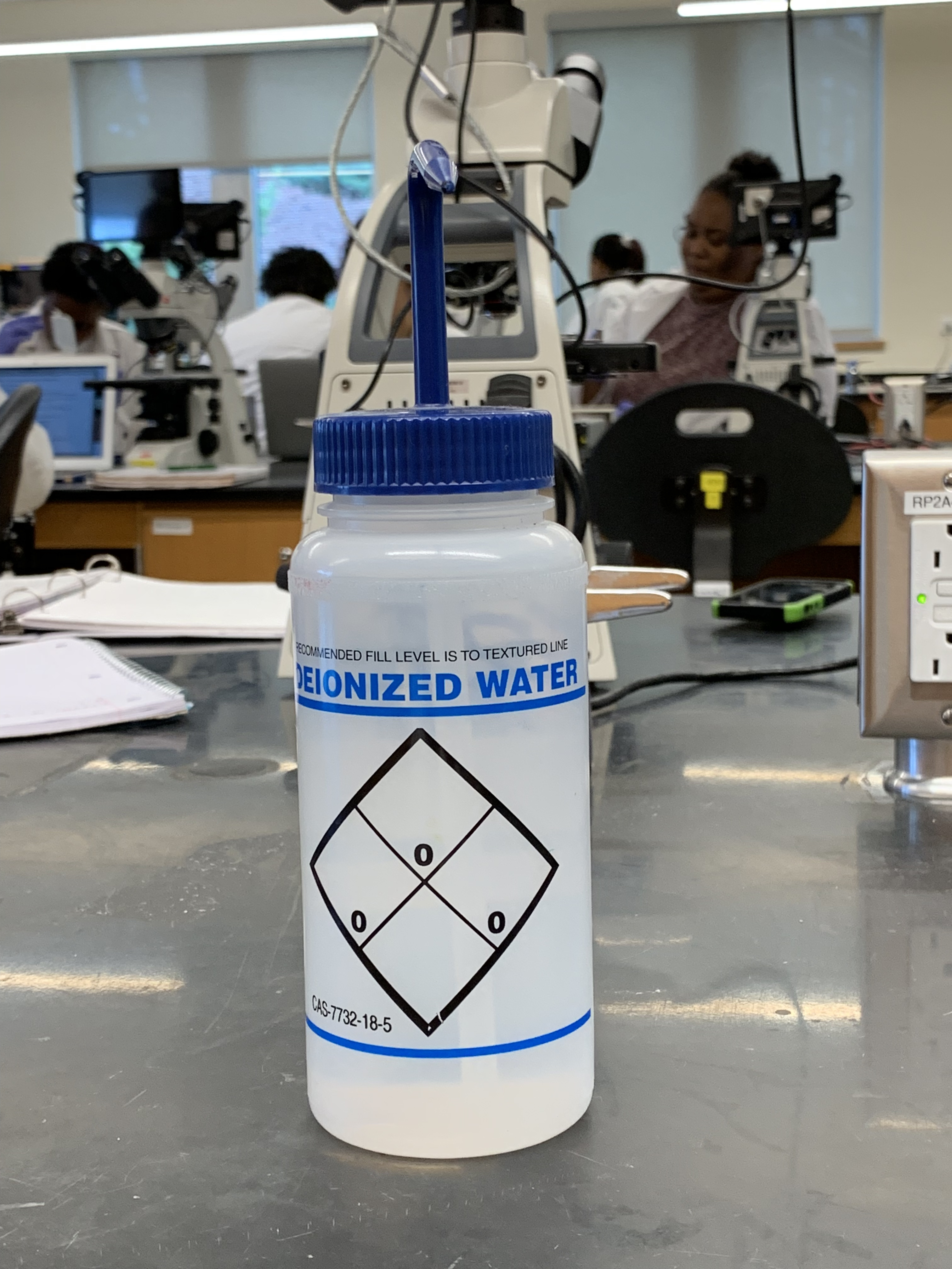 Bottle containing deionized water for use in the experiments.