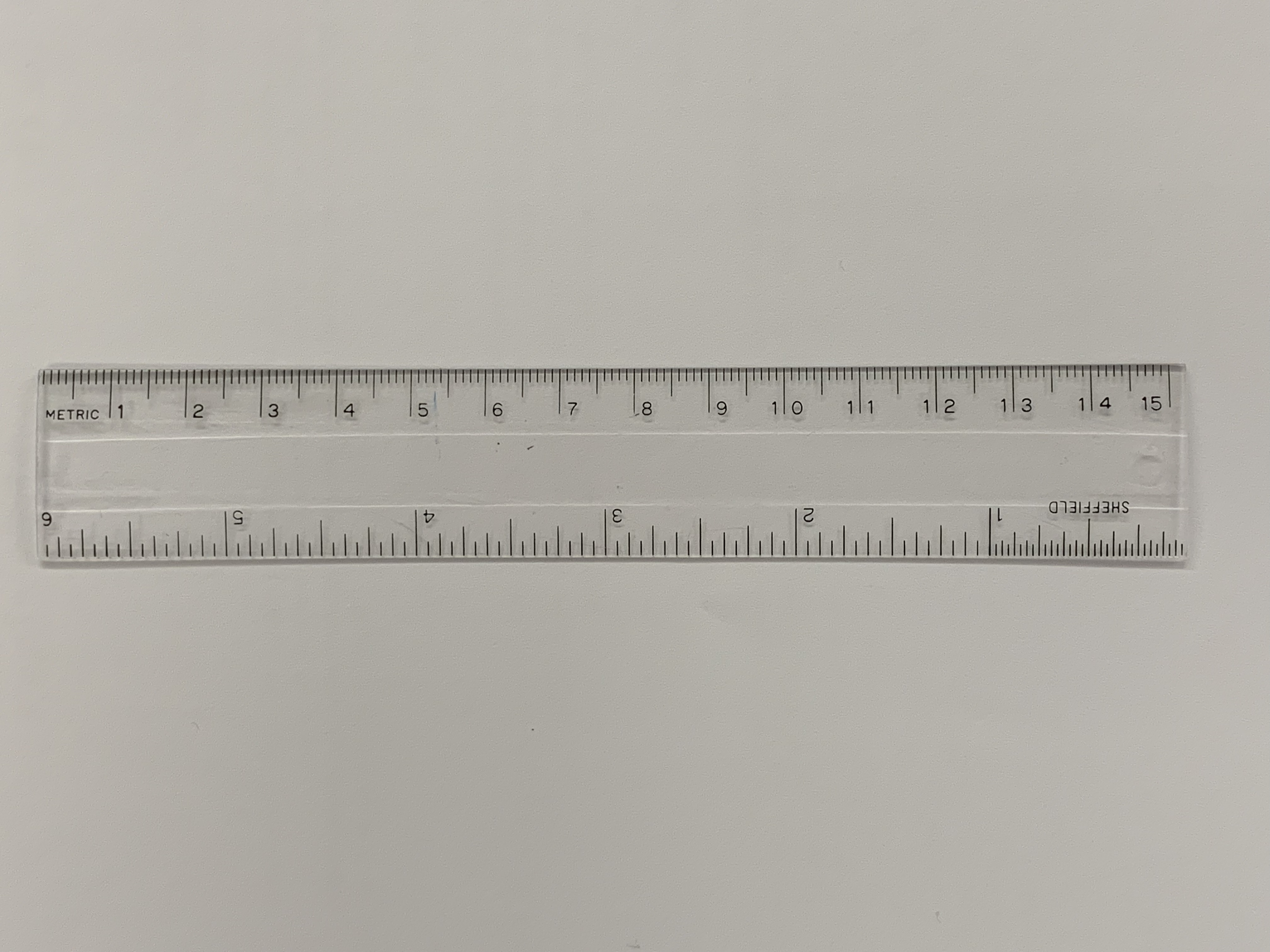 A ruler with metric (cm) and imperial (inch) scales.